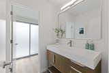 Bath Room, Porcelain Tile Wall, Ceiling Lighting, Vessel Sink, One Piece Toilet, Enclosed Shower, Wall Lighting, and Stone Counter  Photo 13 of 20 in The Strawberry 94087 Eichler by Boyenga Team