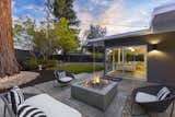 Outdoor, Concrete Patio, Porch, Deck, Concrete Pools, Tubs, Shower, Grass, Trees, Shrubs, Back Yard, Vertical Fences, Wall, Hardscapes, and Wood Fences, Wall  Photo 19 of 20 in The Strawberry 94087 Eichler by Boyenga Team