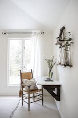 Brianna’s passion for DIY dovetailed with her sister’s focus on reducing waste and costs. She used an IKEA tabletop for the cantilevered desk, strung up shelves, and repainted old hardware like the curtain rod above. &nbsp;