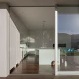 Kitchen from exterior with cat.