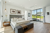The primary bedroom is a sanctuary with water views.