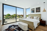 Two luxurious guest bedrooms with baths en suite are lavish with bespoke materials and finishes.