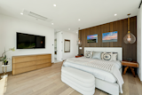 Two luxurious guest bedrooms with baths en suite are lavish with bespoke materials and finishes