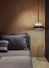 Bedroom, Ceramic Tile Floor, Bed, and Pendant Lighting  Photo 10 of 22 in Copper Cube Haus by DIG Architects