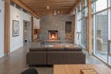 Living Room, Concrete Floor, and Wood Burning Fireplace  Photo 3 of 9 in House in Scotch Cove by FBM Architecture | Interior Design | Planning