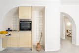 Kitchen, Wood Cabinet, Porcelain Tile Backsplashe, Concrete Floor, Wood Counter, and Drop In Sink Kitchenette  Photo 1 of 15 in Lycabettus Studio Apartment by SOUTH architecture