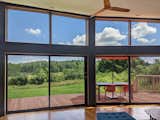 Because of the shallow depth of the house, the dynamic presence of the natural world is a constant, visceral companion throughout the space.