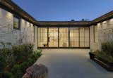 Exterior, Tile Roof Material, Hipped RoofLine, Brick Siding Material, and House Building Type Courtyard   Photo 3 of 19 in Mountain Shadows by Catalano Architects