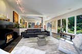 Beautiful light-filled living space with fireplace surround using one-piece blackened steel designed by owner and prominent Seattle architect, Dan Foltz.