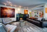 This beautiful living space with breathtaking blackened steel gas fireplace and an open design into the dining room and kitchen.