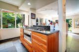 Gorgeous cherry wood cabinetry and lustrous 33" granite counter tops with gas cooktop.