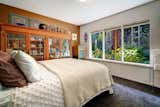 Main floor bedroom perfectly looks out to landscape and gardens.