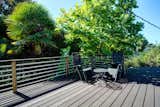 Beautiful top floor deck off primary bedroom with peek at Lake Union.