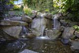 Spectacular waterfall water feature highlights the gorgeous Architectural-design landscape.