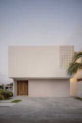 Exterior, Beach House Building Type, Flat RoofLine, Concrete Siding Material, and Wood Siding Material front facade view  Photo 2 of 12 in Minimalism and Warmth Harmonize in This Boxy Home Near Puerto Vallarta from Veronica House