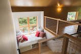 Romantic window seat with western view also provides twin bed overflow sleeping.