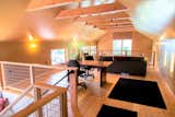 Upstairs loft for work, games or overflow sleeping.