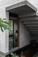 Outdoor, Side Yard, Metal Patio, Porch, Deck, Landscape Lighting, Stone Patio, Porch, Deck, Concrete Patio, Porch, Deck, Trees, Metal Fences, Wall, and Small Pools, Tubs, Shower Stairs and view to living room  Photo 5 of 17 in R.A House by Estudio Radillo Alba