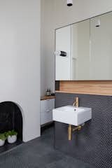 Bath Room, Pendant Lighting, Accent Lighting, Subway Tile Wall, Wall Lighting, Wood Counter, Ceramic Tile Floor, Wall Mount Sink, and Mosaic Tile Wall Ensuite vanity wall   Photo 12 of 21 in Thanks to a Double-Height Dining Room, a Melbourne Home Basks in Sunshine and Courtyard Views from South Yarra Void House