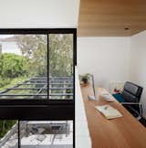 Office, Study Room Type, Chair, Carpet Floor, and Desk Study space overlooking void above dining space  Photo 10 of 21 in Thanks to a Double-Height Dining Room, a Melbourne Home Basks in Sunshine and Courtyard Views from South Yarra Void House