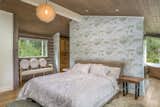 The primary en-suite bedroom offers views of the aspens.&nbsp;