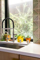 Kitchen sink with custom moroccan wall tiles