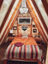 The interior of the Forest Nook is warm and cozy with a large chandelier