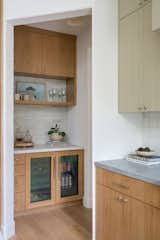 Kitchen, Wine Cooler, Colorful Cabinet, Marble Counter, Wood Cabinet, and Light Hardwood Floor  Photo 2 of 18 in So Rad in Carlsbad by Katie Betyar