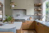 Kitchen, Quartzite Counter, Light Hardwood Floor, Range, Undermount Sink, Marble Counter, Wood Cabinet, Colorful Cabinet, and Pendant Lighting  Photo 10 of 18 in So Rad in Carlsbad by Katie Betyar