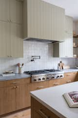 Kitchen, Wood Cabinet, Colorful Cabinet, Range, Marble Counter, Range Hood, and Light Hardwood Floor  Photo 12 of 18 in So Rad in Carlsbad by Katie Betyar