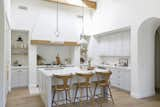 Kitchen, Light Hardwood Floor, Range, Colorful Cabinet, Pendant Lighting, and Subway Tile Backsplashe  Photo 3 of 26 in Cali Cool and Collected by Katie Betyar