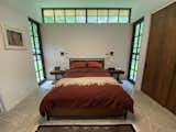 Bedroom, Concrete Floor, Wardrobe, Bed, and Wall Lighting Master Bedroom  Photo 4 of 9 in 25 Hillside Ave by avi forman