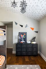 Bedroom, Pendant Lighting, Dark Hardwood Floor, and Dresser  Photo 2 of 4 in Expanding Function — Not Square Footage — in Manhattan Beach by Alexandria Abramian