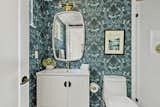In one of the home's three bathrooms, LaMarque selected wallcoverings that evoke the home's mountain environment. 