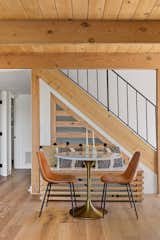 LaMarque activated an unused area under the stairs by adding a built-in bench to create a dining area.
