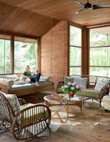 Brenda and Ruby sit comfortably on the swinging daybed, located in their screened-in porch. The wicker furniture, found in Maine, is over 100 years old.