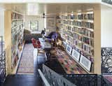 The library, or “basket of books,” feels like a warm cocoon. The prints along the bottom shelf are by Giorgio Morandi.
