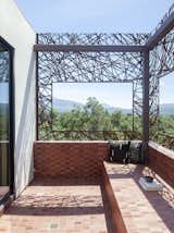 The “moon viewing” mirador porch sits off of the main bedroom and bathroom, framing the verdant countryside.