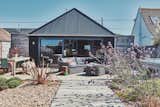 The bungalow's back-deck, with its inviting lounge space and warm, weathered scaffolding floors.