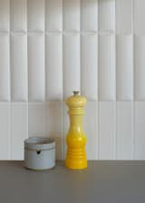 In the main house kitchen, a puffy arched tile mimics the arches in other locations of the house, like the entrance patio of the ADU.