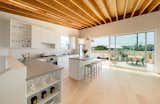 Shin Shin Architecture added a new level that holds the kitchen/dining/living area for the main residence.