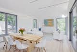 The light-filled living space upstairs blends a lounge with a dining room and the thoroughly modern kitchen.