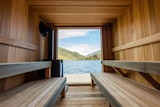Aux Box’s floating sauna at Tofino Resort &amp; Marina features a wood-burning stove and all-cedar interiors.