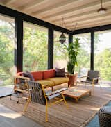 This newly built Austin residence cleverly reimagines the shotgun layout while paying tribute to its owner’s Louisiana roots.&nbsp;A floating steel stair in the central vestibule takes visitors to the second floor, where an oversize screened porch peers over the city’s downtown skyline.