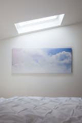 The cloud linen and imagery placed just below the skylight offers atmospheric views when you open your eyes every morning.