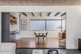 Dining Room, Table, Ceiling Lighting, Dark Hardwood Floor, Stools, Bar, Chair, and Slate Floor  Photo 14 of 52 in Rancho Mirage Lane by Chris Salay