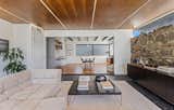 Dining Room, Table, Ceiling Lighting, Slate Floor, Medium Hardwood Floor, Chair, and Stools  Photo 15 of 52 in Rancho Mirage Lane by Chris Salay