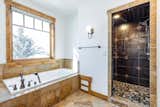 Bath Room, Drop In Sink, Granite Counter, Full Shower, Pendant Lighting, Drop In Tub, Accent Lighting, Whirlpool Tub, Soaking Tub, Ceramic Tile Floor, Two Piece Toilet, Recessed Lighting, Enclosed Shower, and Ceramic Tile Wall  Photo 6 of 9 in Mountain Life Estate by sam williams