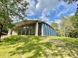 Exterior, House Building Type, Concrete Siding Material, Metal Roof Material, and Curved RoofLine  Photo 4 of 5 in The Water Castle by Julia Vang