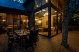 An elevated wrap-around deck allows for the continued growth of the existing trees, making them a charming, whimsical inclusion